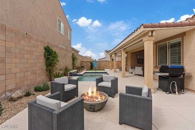 view of patio / terrace featuring grilling area, a fenced in pool, an outdoor living space with a fire pit, and a fenced backyard