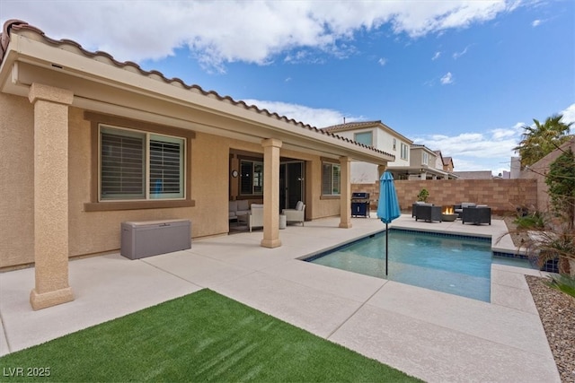 view of swimming pool with fence, grilling area, a fenced in pool, an outdoor hangout area, and a patio area