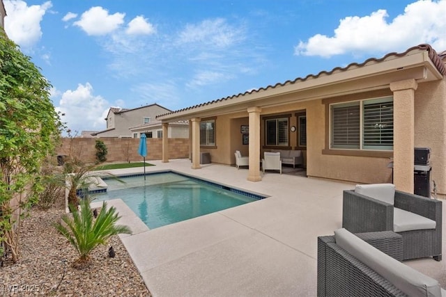 view of swimming pool featuring a patio area, a fenced in pool, a fenced backyard, and an outdoor hangout area