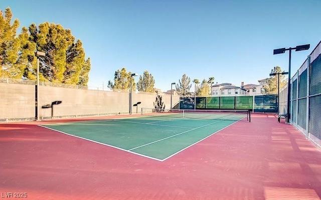 view of sport court featuring community basketball court and fence