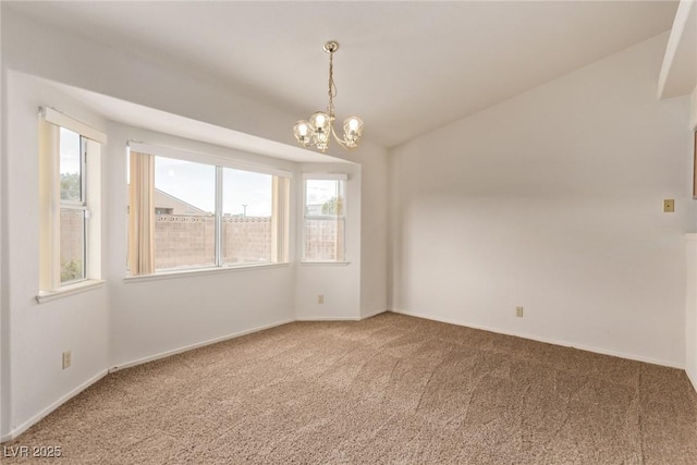 unfurnished room with a chandelier, carpet flooring, baseboards, and vaulted ceiling