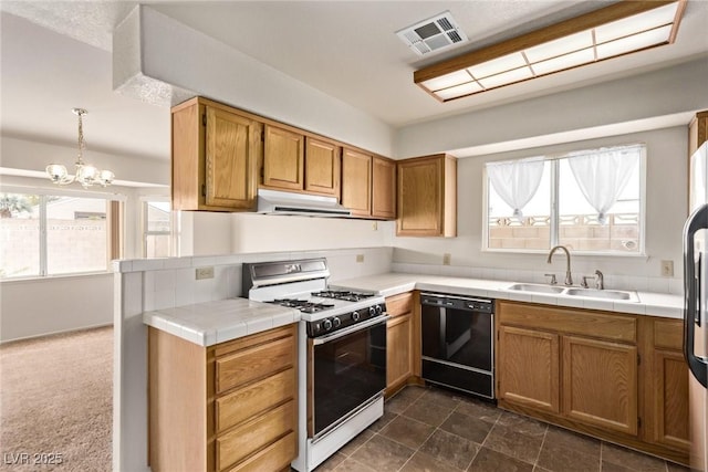 kitchen with visible vents, under cabinet range hood, a sink, black dishwasher, and white range with gas stovetop