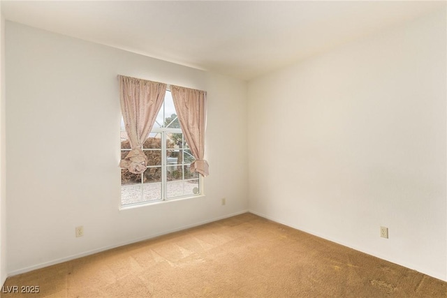 empty room featuring light colored carpet