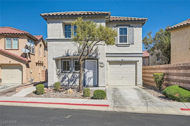 mediterranean / spanish-style house featuring fence, a tile roof, stucco siding, a garage, and driveway