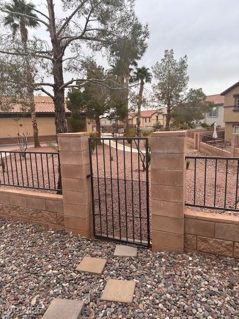 view of gate featuring fence