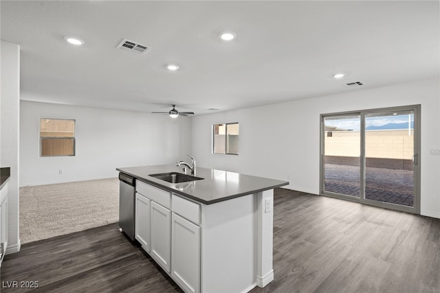 kitchen featuring a sink, dark countertops, open floor plan, dishwasher, and ceiling fan