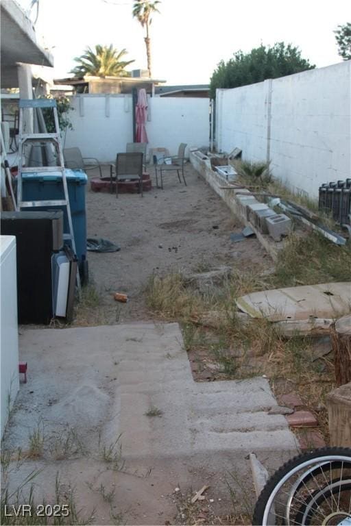 view of yard featuring a patio and fence