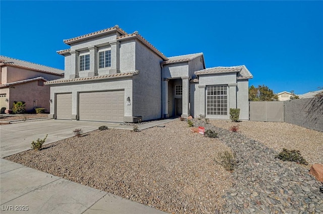 7900 Holly Knoll Ave, Las Vegas, NV 89129 - view of front facade featuring a garage, a tiled roof, concrete driveway, stucco siding, and fence