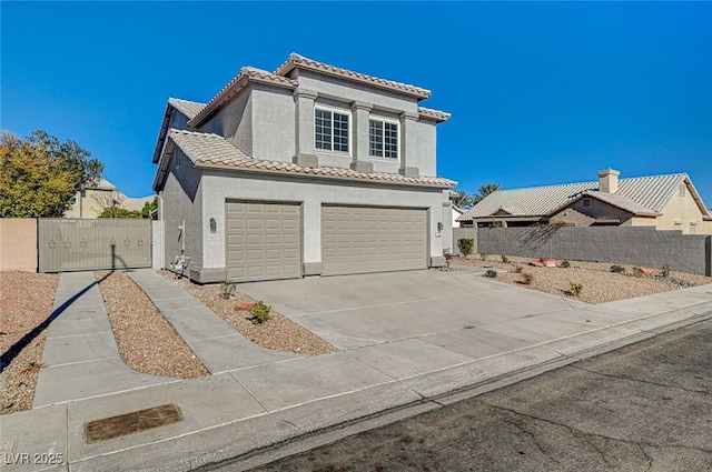 mediterranean / spanish-style home featuring fence, driveway, an attached garage, stucco siding, and a tile roof