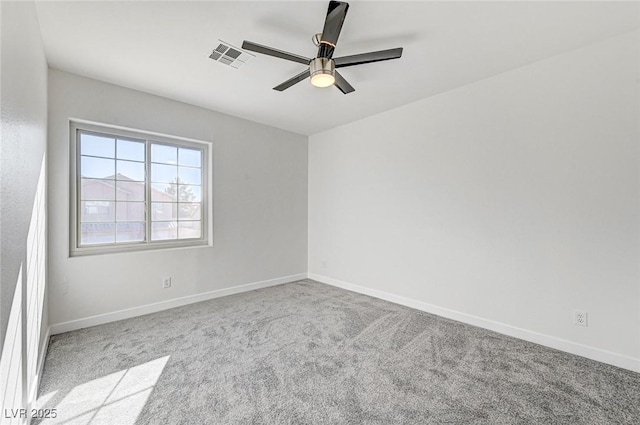 empty room with visible vents, ceiling fan, baseboards, and carpet floors