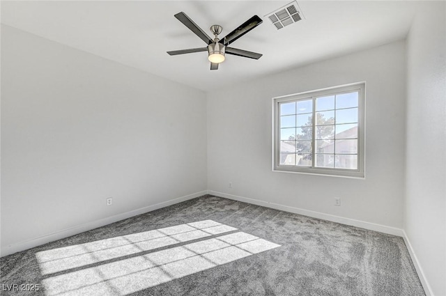 unfurnished room with visible vents, baseboards, carpet, and ceiling fan