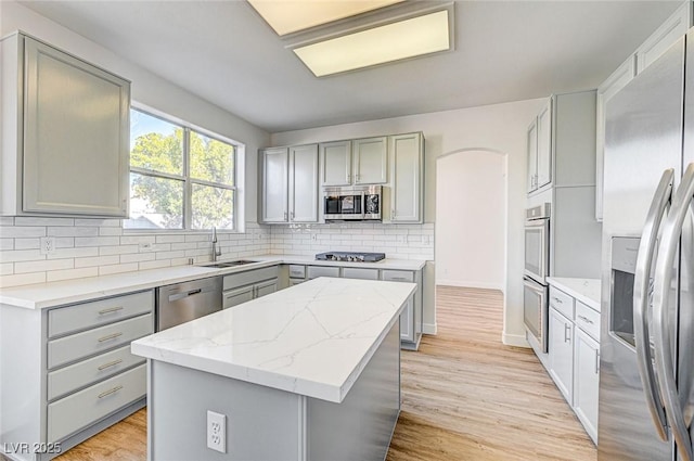 7900 Holly Knoll Ave, Las Vegas, NV 89129 - kitchen featuring a sink, stainless steel appliances, a kitchen island, and gray cabinets
