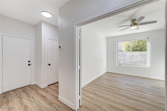 7900 Holly Knoll Ave, Las Vegas, NV 89129 - foyer featuring baseboards, a ceiling fan, and light wood finished floors