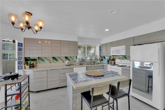 kitchen featuring marble finish floor, white appliances, modern cabinets, and a sink