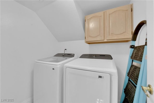 clothes washing area with cabinet space and washing machine and dryer