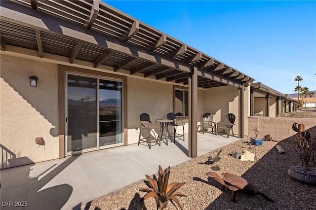 view of patio with fence and a pergola