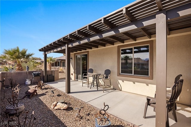 view of patio / terrace featuring a pergola and fence