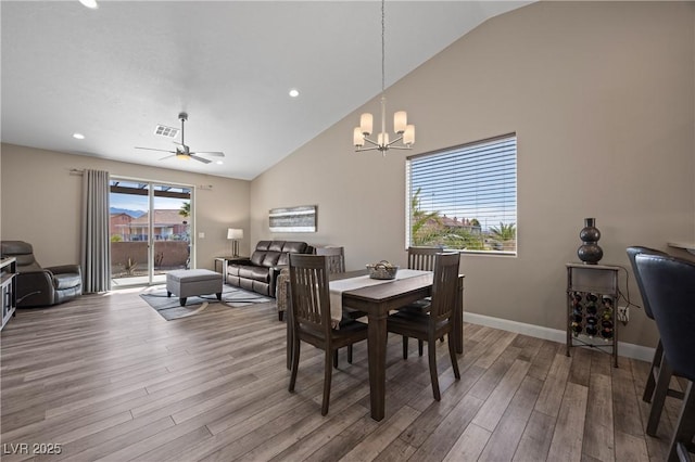 dining space featuring visible vents, ceiling fan with notable chandelier, wood finished floors, recessed lighting, and baseboards