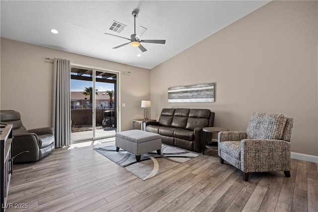 living room featuring visible vents, ceiling fan, lofted ceiling, recessed lighting, and wood finished floors