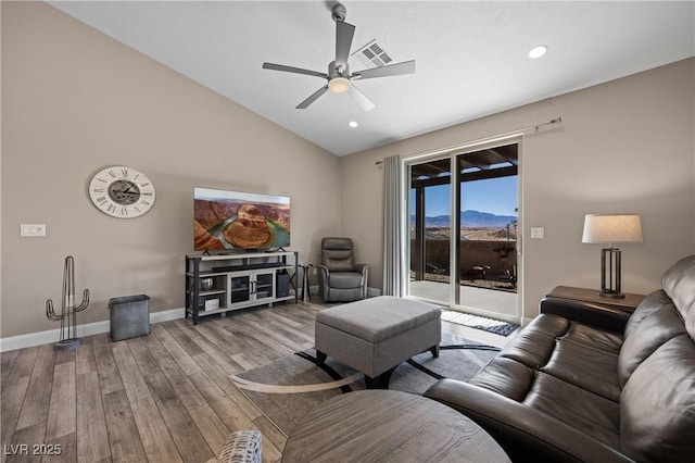 living room with a ceiling fan, wood finished floors, visible vents, baseboards, and lofted ceiling