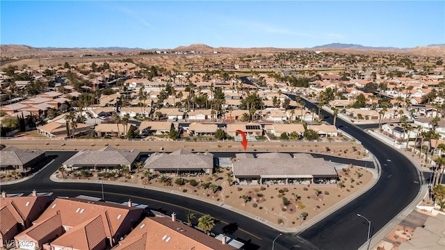 drone / aerial view featuring a mountain view and a residential view