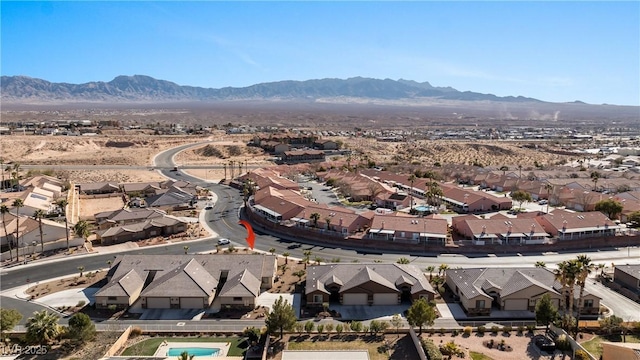 birds eye view of property with a mountain view and a residential view