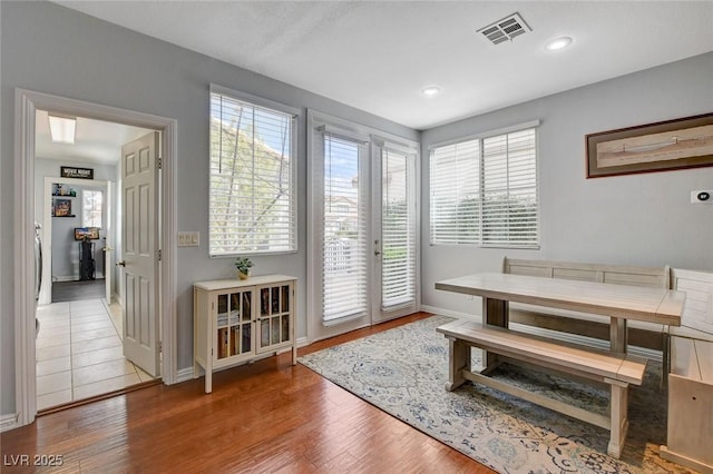 dining room featuring recessed lighting, visible vents, baseboards, and wood finished floors