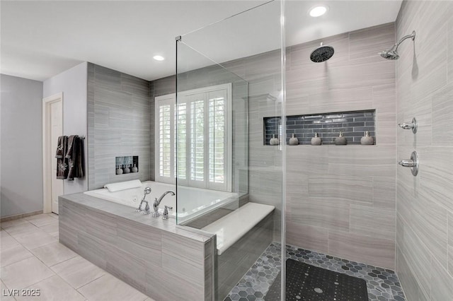 full bath featuring a bath, tile patterned flooring, and a tile shower