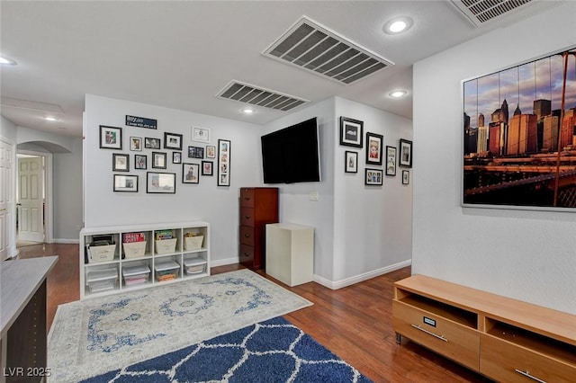 interior space with recessed lighting, wood finished floors, and visible vents