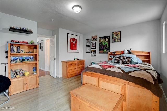 bedroom featuring light wood-style floors