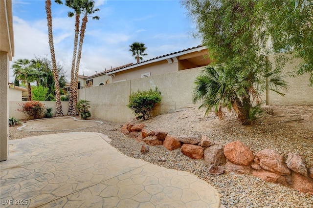 view of yard featuring a fenced backyard and a patio