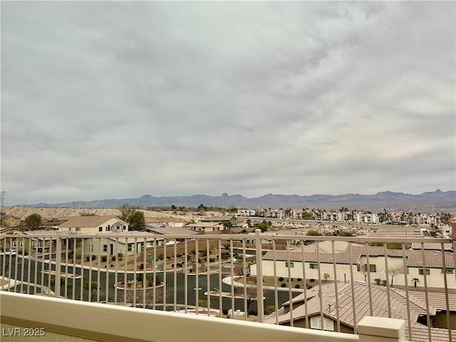 balcony featuring a mountain view and a residential view