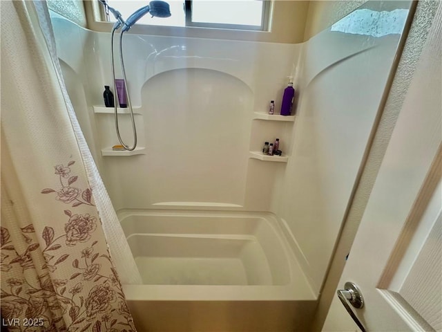 bathroom featuring a shower with shower curtain