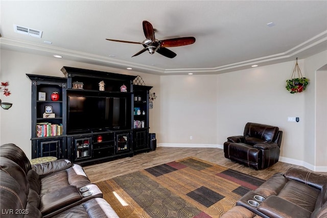 living room with wood finished floors, a ceiling fan, visible vents, baseboards, and recessed lighting