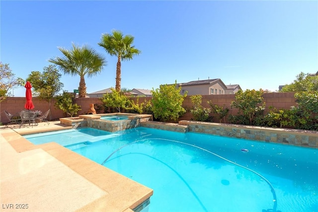 view of swimming pool with a patio area, a fenced backyard, and a pool with connected hot tub