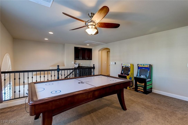 game room featuring baseboards, ceiling fan, carpet floors, recessed lighting, and arched walkways