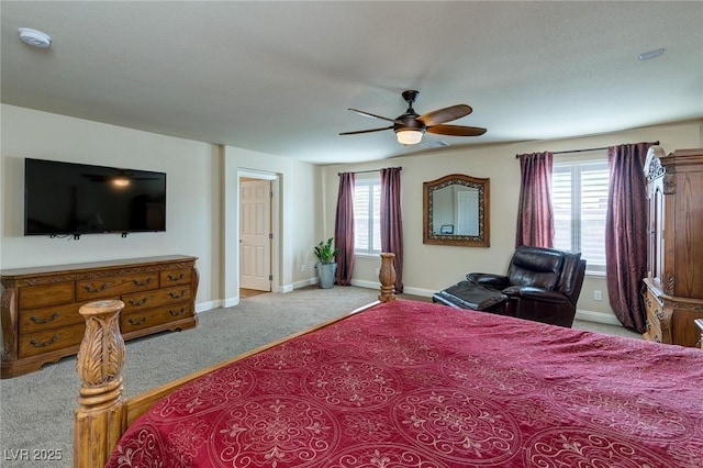 bedroom with carpet flooring, multiple windows, baseboards, and ceiling fan