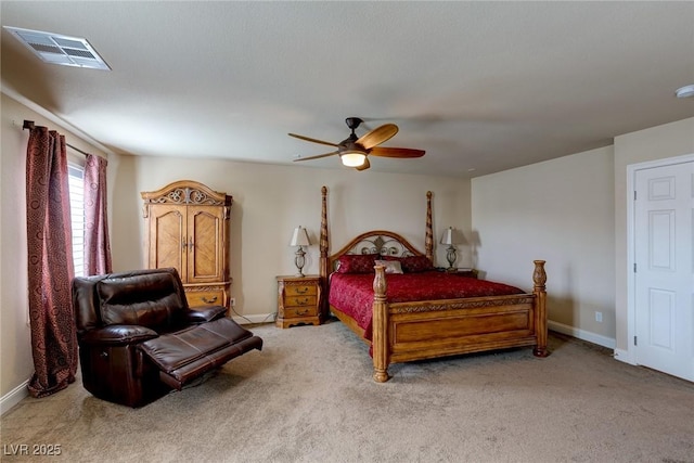 carpeted bedroom featuring baseboards, visible vents, and ceiling fan