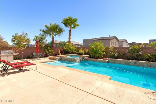 view of swimming pool featuring a patio area, grilling area, a pool with connected hot tub, and a fenced backyard