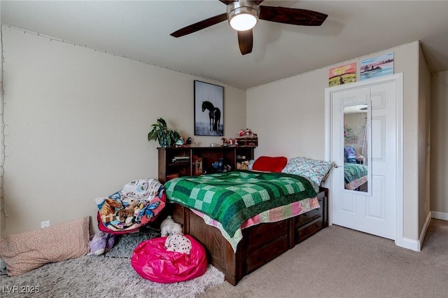 bedroom with carpet flooring, baseboards, and a ceiling fan