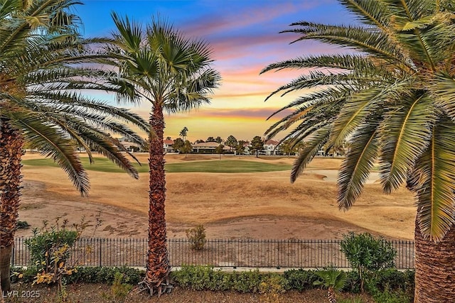 view of property's community featuring fence