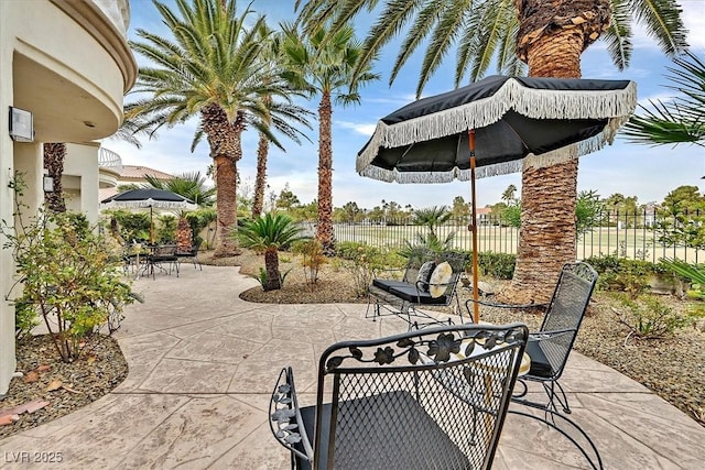 view of patio featuring fence private yard and outdoor dining space