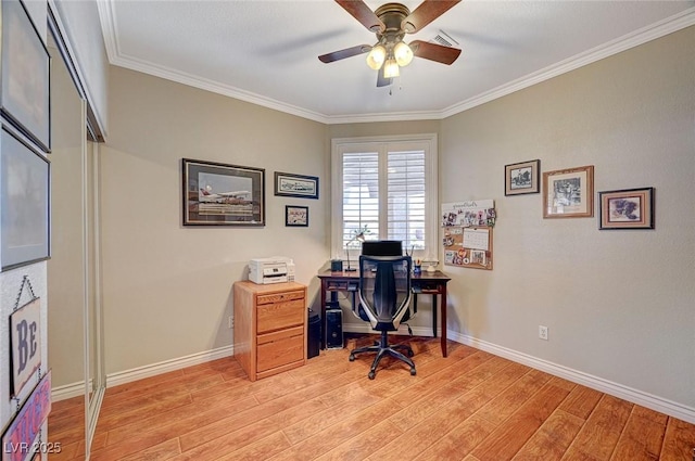 office space with baseboards, light wood-style floors, ceiling fan, and crown molding