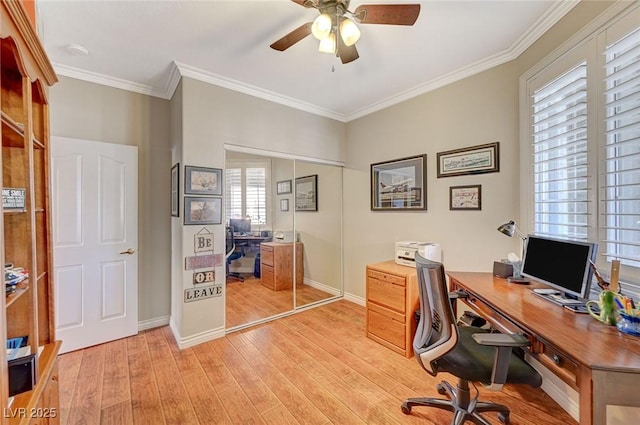 office with baseboards, a ceiling fan, light wood-type flooring, and ornamental molding