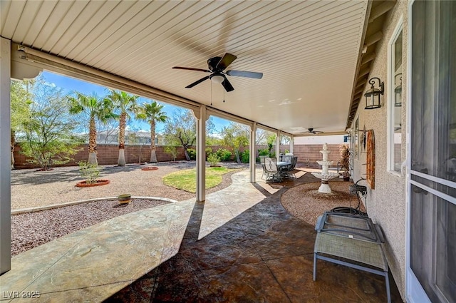 view of patio / terrace with a fenced backyard and ceiling fan