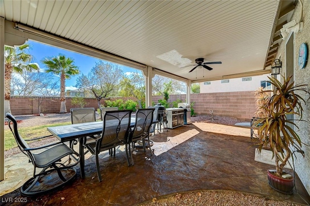 view of patio / terrace with outdoor dining area, a fenced backyard, grilling area, and ceiling fan