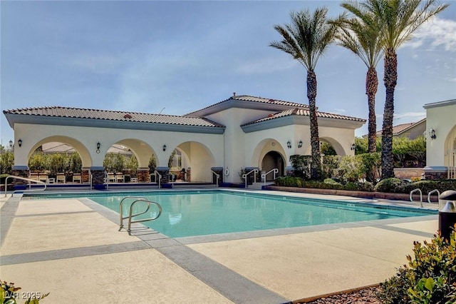 community pool with a patio