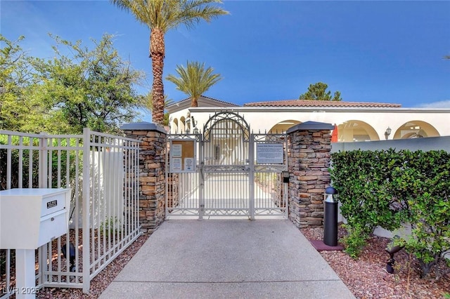 view of gate with fence