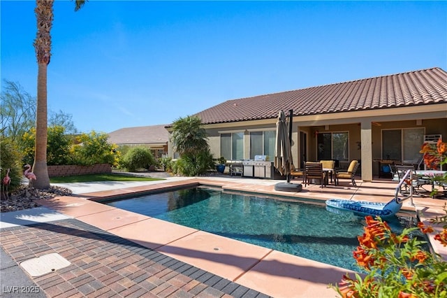 outdoor pool featuring a patio