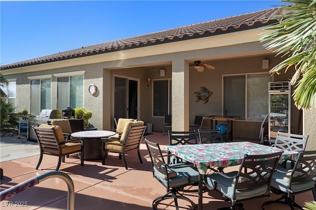 view of patio featuring outdoor dining area and an outdoor kitchen